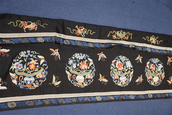 A Chinese embroidered black satin table frontal, late Qing dynasty, 211 x 56cm